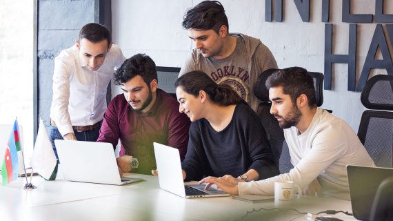 colleagues-working-project-discussing-details